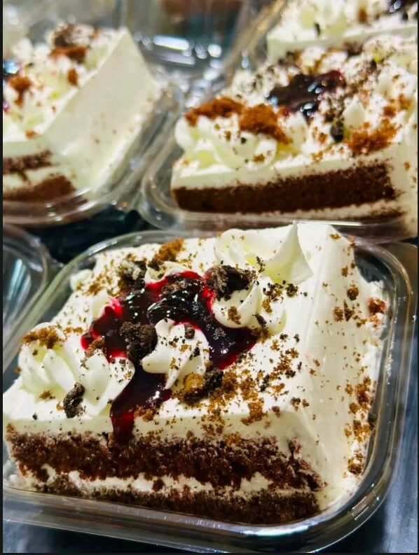 Black forest cake slices in takeaway containers