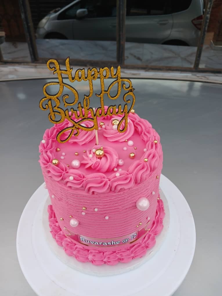 Pink piped birthday cake
